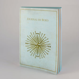 Notebook con copertina Journal de bord e laterali oro.